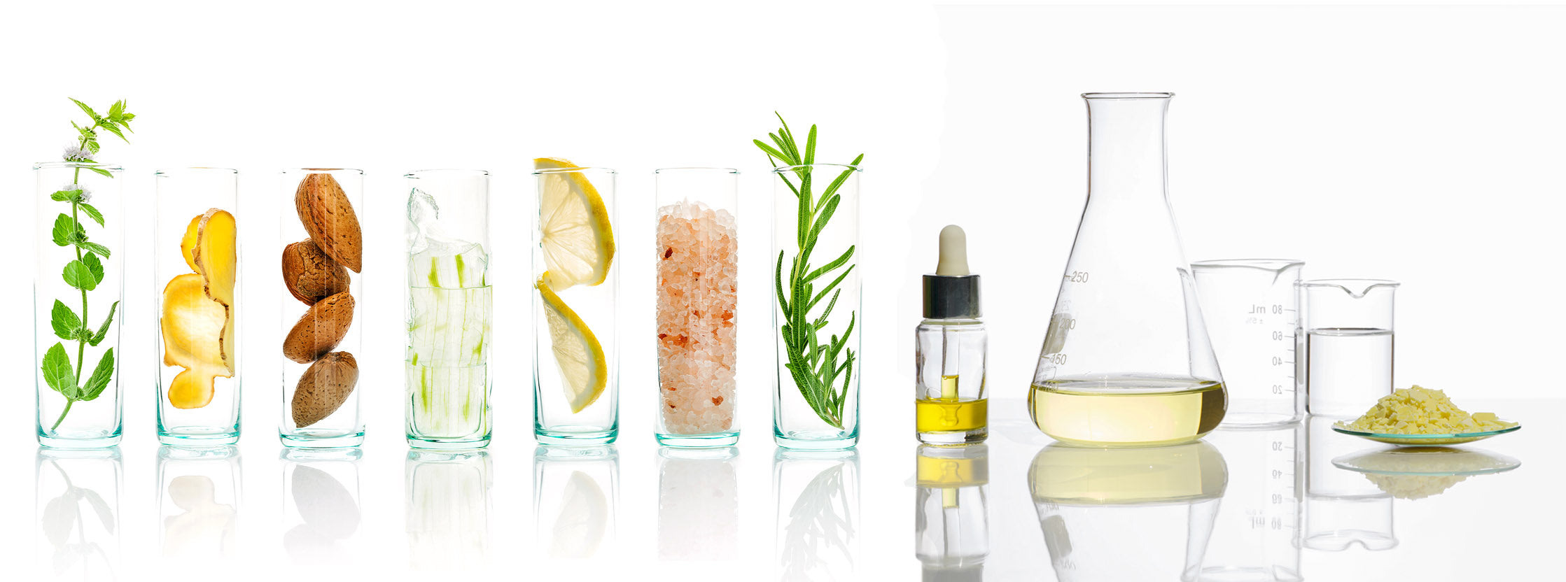 Flat lay of luxury skincare and bodycare products featuring natural African ingredients like baobab oil, aloe vera, and shea butter on a neutral-toned background.